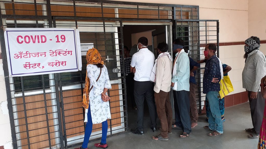 People queuing at a COVID-19 antigen testing centre in Maharashtra, India