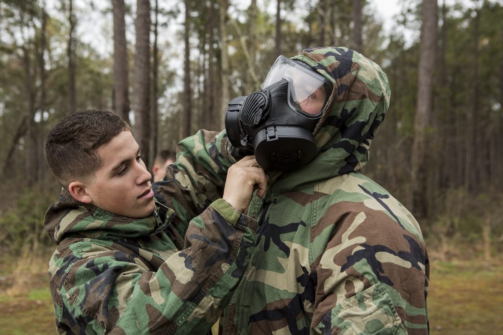 Emergency responders in protective equipment during a CBRN decontamination exercise